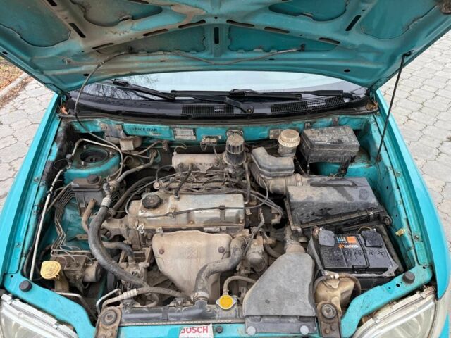 Зеленый Мицубиси Спейс Стар, объемом двигателя 1.3 л и пробегом 205 тыс. км за 3000 $, фото 16 на Automoto.ua