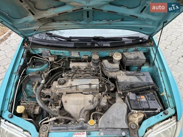 Зеленый Мицубиси Спейс Стар, объемом двигателя 1.3 л и пробегом 203 тыс. км за 3000 $, фото 16 на Automoto.ua