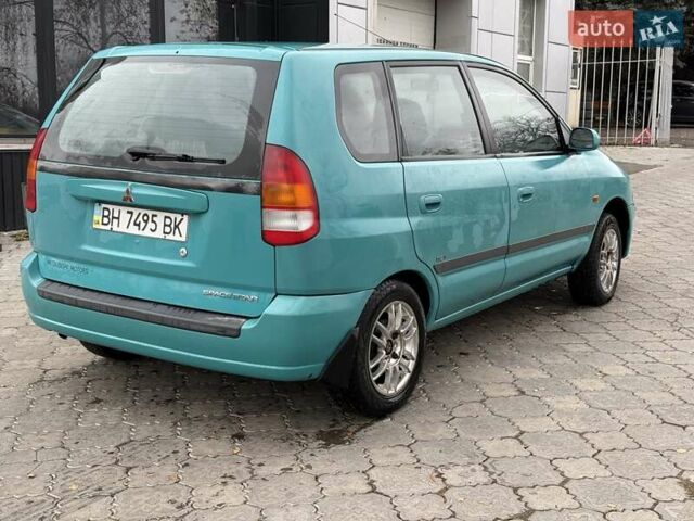 Зеленый Мицубиси Спейс Стар, объемом двигателя 1.3 л и пробегом 203 тыс. км за 3000 $, фото 3 на Automoto.ua