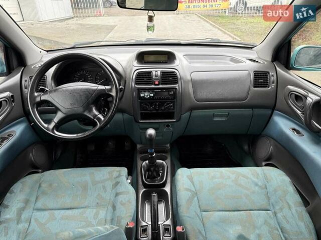 Зеленый Мицубиси Спейс Стар, объемом двигателя 1.3 л и пробегом 203 тыс. км за 3000 $, фото 12 на Automoto.ua