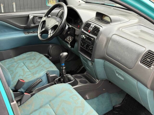 Зеленый Мицубиси Спейс Стар, объемом двигателя 1.3 л и пробегом 205 тыс. км за 3000 $, фото 11 на Automoto.ua