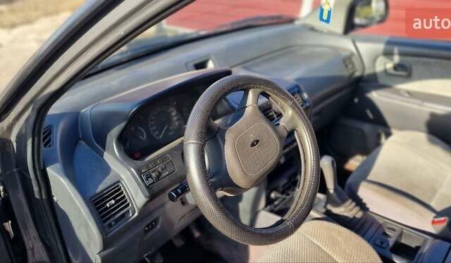 Серый Мицубиси Спейс Вагон, объемом двигателя 1.8 л и пробегом 410 тыс. км за 2000 $, фото 17 на Automoto.ua