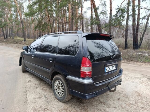 Синий Мицубиси Спейс Вагон, объемом двигателя 2.4 л и пробегом 333 тыс. км за 1000 $, фото 5 на Automoto.ua