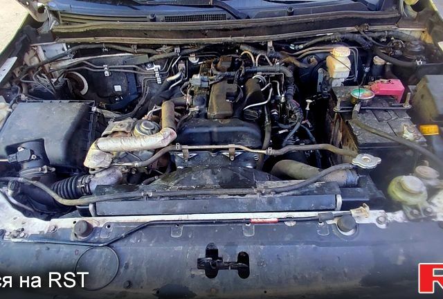 Белый Мицубиси L200, объемом двигателя 2.4 л и пробегом 330 тыс. км за 15000 $, фото 6 на Automoto.ua