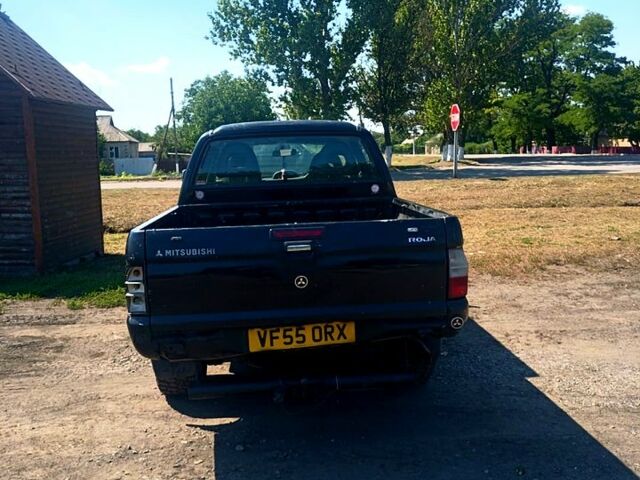 Черный Мицубиси L200, объемом двигателя 2.5 л и пробегом 142 тыс. км за 3700 $, фото 3 на Automoto.ua