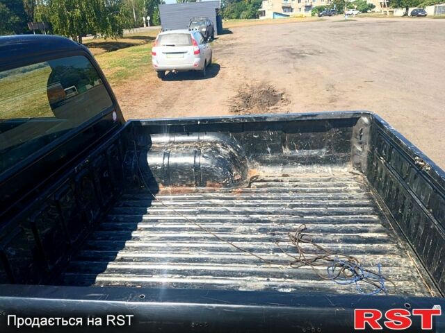 Черный Мицубиси L200, объемом двигателя 2.5 л и пробегом 142 тыс. км за 3700 $, фото 4 на Automoto.ua