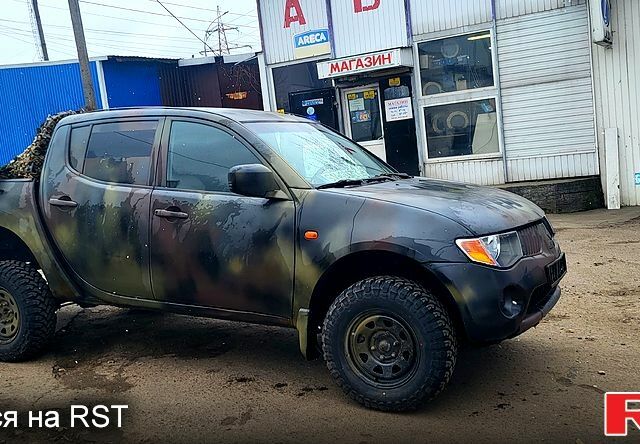 Черный Мицубиси L200, объемом двигателя 2.5 л и пробегом 0 тыс. км за 6500 $, фото 1 на Automoto.ua