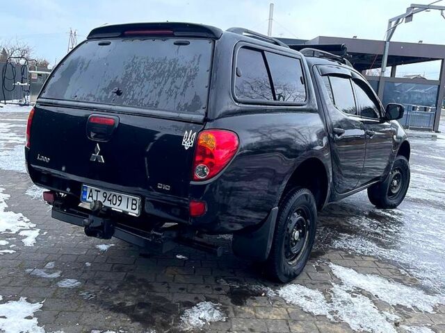 Черный Мицубиси L200, объемом двигателя 2.5 л и пробегом 226 тыс. км за 13900 $, фото 3 на Automoto.ua