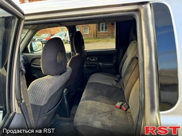 Серый Мицубиси L200, объемом двигателя 2.5 л и пробегом 213 тыс. км за 4800 $, фото 6 на Automoto.ua