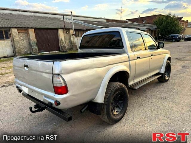 Серый Мицубиси L200, объемом двигателя 2.5 л и пробегом 213 тыс. км за 4800 $, фото 3 на Automoto.ua