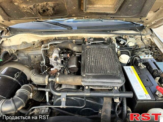 Серый Мицубиси L200, объемом двигателя 2.5 л и пробегом 213 тыс. км за 4800 $, фото 7 на Automoto.ua