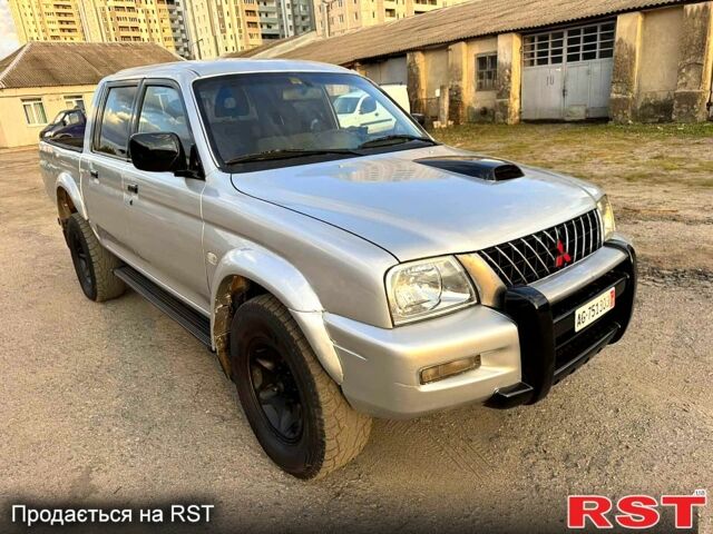 Серый Мицубиси L200, объемом двигателя 2.5 л и пробегом 213 тыс. км за 4800 $, фото 2 на Automoto.ua