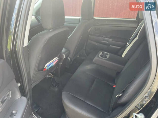 Черный Мицубиси Outlander Sport, объемом двигателя 2 л и пробегом 205 тыс. км за 10750 $, фото 14 на Automoto.ua