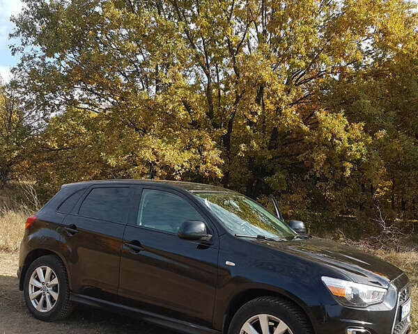 Черный Мицубиси Outlander Sport, объемом двигателя 2.4 л и пробегом 204 тыс. км за 11900 $, фото 1 на Automoto.ua