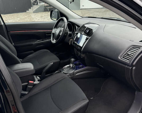 Черный Мицубиси Outlander Sport, объемом двигателя 2 л и пробегом 157 тыс. км за 11900 $, фото 14 на Automoto.ua