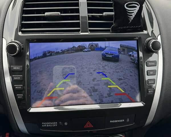 Черный Мицубиси Outlander Sport, объемом двигателя 2 л и пробегом 157 тыс. км за 11900 $, фото 22 на Automoto.ua