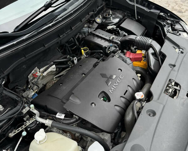 Черный Мицубиси Outlander Sport, объемом двигателя 2 л и пробегом 157 тыс. км за 11900 $, фото 24 на Automoto.ua