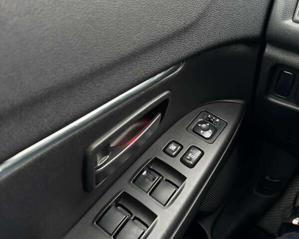 Черный Мицубиси Outlander Sport, объемом двигателя 2 л и пробегом 157 тыс. км за 11900 $, фото 20 на Automoto.ua