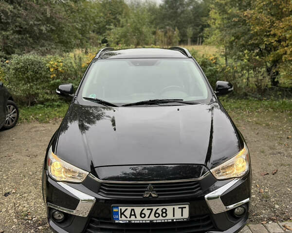 Черный Мицубиси Outlander Sport, объемом двигателя 2.4 л и пробегом 140 тыс. км за 11000 $, фото 1 на Automoto.ua