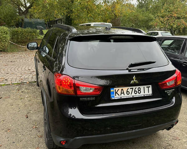 Черный Мицубиси Outlander Sport, объемом двигателя 2.4 л и пробегом 140 тыс. км за 11000 $, фото 5 на Automoto.ua