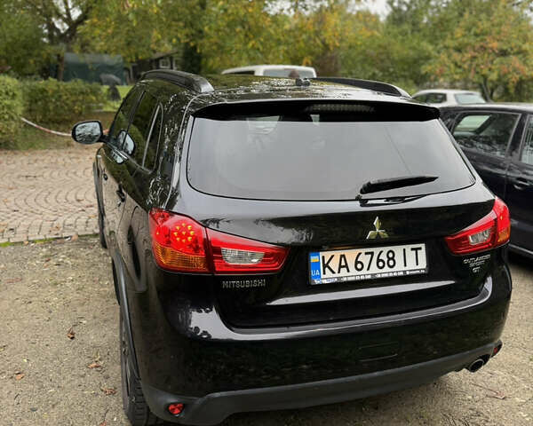 Черный Мицубиси Outlander Sport, объемом двигателя 2.4 л и пробегом 140 тыс. км за 11000 $, фото 4 на Automoto.ua