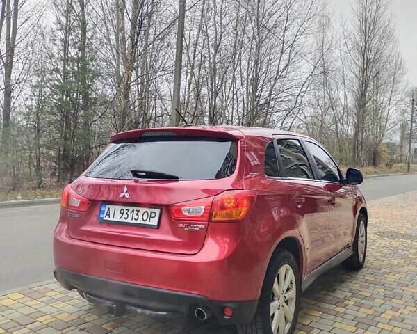 Красный Мицубиси Outlander Sport, объемом двигателя 2 л и пробегом 203 тыс. км за 9250 $, фото 5 на Automoto.ua