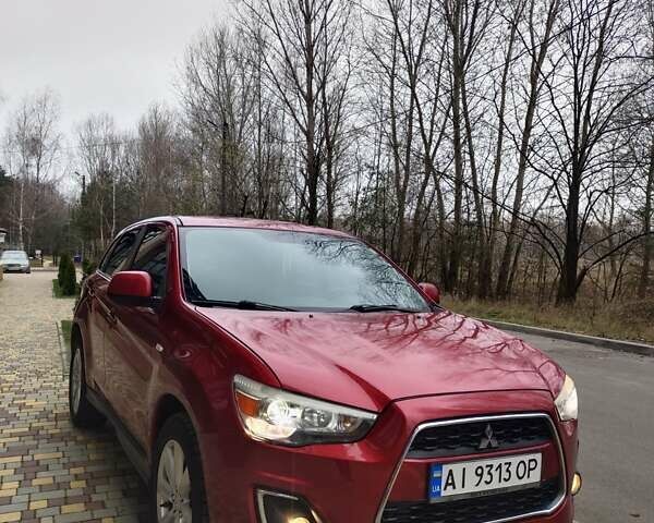 Красный Мицубиси Outlander Sport, объемом двигателя 2 л и пробегом 203 тыс. км за 9250 $, фото 2 на Automoto.ua