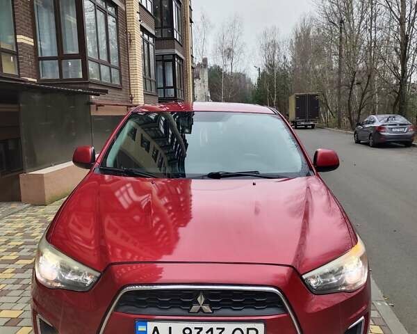 Красный Мицубиси Outlander Sport, объемом двигателя 2 л и пробегом 203 тыс. км за 9250 $, фото 1 на Automoto.ua