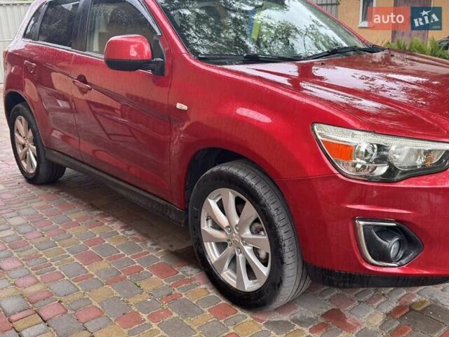 Красный Мицубиси Outlander Sport, объемом двигателя 2 л и пробегом 172 тыс. км за 12500 $, фото 2 на Automoto.ua