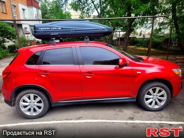 Красный Мицубиси Outlander Sport, объемом двигателя 2 л и пробегом 220 тыс. км за 11300 $, фото 5 на Automoto.ua