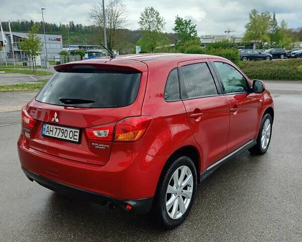 Красный Мицубиси Outlander Sport, объемом двигателя 2 л и пробегом 170 тыс. км за 10500 $, фото 6 на Automoto.ua