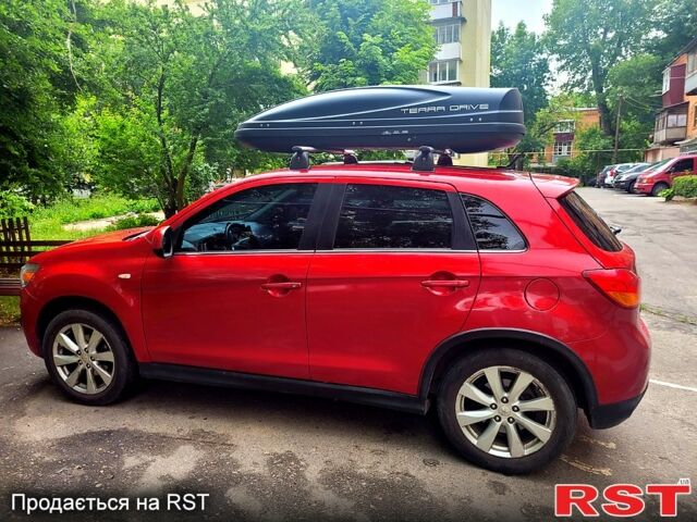 Красный Мицубиси Outlander Sport, объемом двигателя 2 л и пробегом 220 тыс. км за 11300 $, фото 4 на Automoto.ua