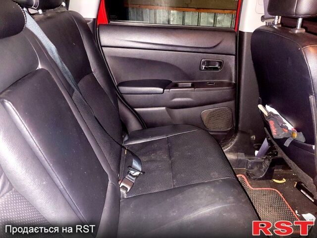 Красный Мицубиси Outlander Sport, объемом двигателя 2 л и пробегом 220 тыс. км за 11300 $, фото 2 на Automoto.ua