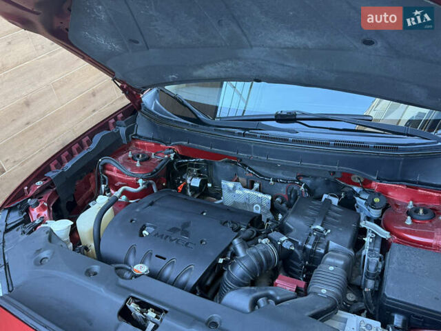 Красный Мицубиси Outlander Sport, объемом двигателя 2 л и пробегом 99 тыс. км за 11999 $, фото 48 на Automoto.ua