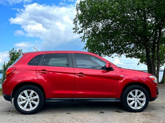 Красный Мицубиси Outlander Sport, объемом двигателя 2 л и пробегом 174 тыс. км за 10700 $, фото 1 на Automoto.ua