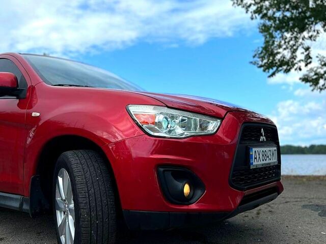 Красный Мицубиси Outlander Sport, объемом двигателя 2 л и пробегом 174 тыс. км за 10700 $, фото 4 на Automoto.ua
