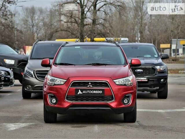 Красный Мицубиси Outlander Sport, объемом двигателя 2 л и пробегом 195 тыс. км за 12800 $, фото 1 на Automoto.ua