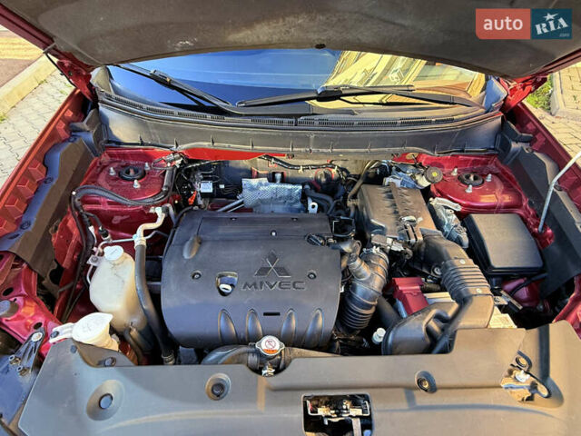 Красный Мицубиси Outlander Sport, объемом двигателя 2 л и пробегом 99 тыс. км за 11999 $, фото 7 на Automoto.ua