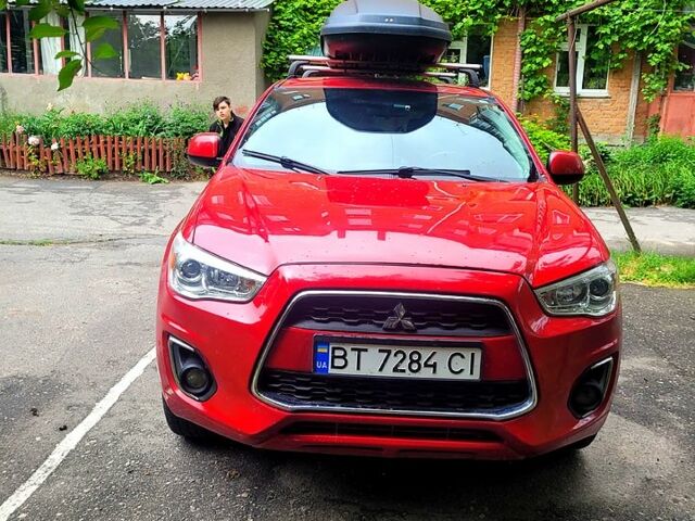 Красный Мицубиси Outlander Sport, объемом двигателя 2 л и пробегом 220 тыс. км за 11300 $, фото 3 на Automoto.ua