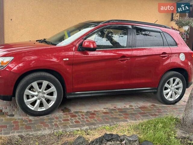 Красный Мицубиси Outlander Sport, объемом двигателя 2 л и пробегом 172 тыс. км за 12500 $, фото 1 на Automoto.ua