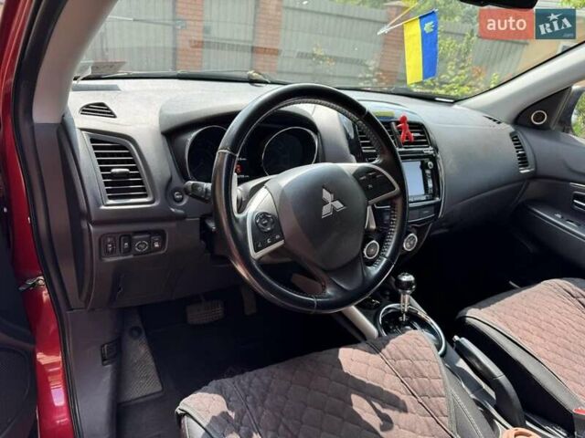 Красный Мицубиси Outlander Sport, объемом двигателя 2 л и пробегом 172 тыс. км за 12500 $, фото 5 на Automoto.ua