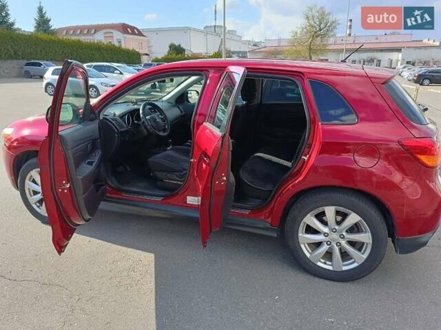 Красный Мицубиси Outlander Sport, объемом двигателя 2 л и пробегом 220 тыс. км за 11500 $, фото 4 на Automoto.ua
