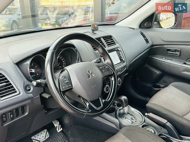 Красный Мицубиси Outlander Sport, объемом двигателя 2 л и пробегом 127 тыс. км за 12499 $, фото 19 на Automoto.ua