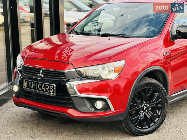Красный Мицубиси Outlander Sport, объемом двигателя 2 л и пробегом 127 тыс. км за 12499 $, фото 1 на Automoto.ua