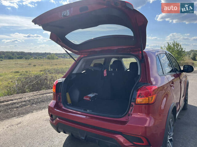 Красный Мицубиси Outlander Sport, объемом двигателя 2 л и пробегом 130 тыс. км за 14300 $, фото 6 на Automoto.ua