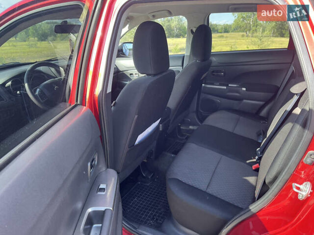 Красный Мицубиси Outlander Sport, объемом двигателя 2 л и пробегом 130 тыс. км за 14300 $, фото 4 на Automoto.ua