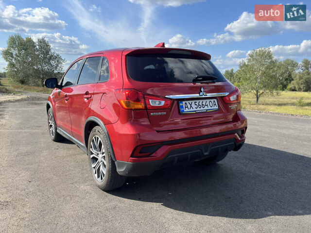 Красный Мицубиси Outlander Sport, объемом двигателя 2 л и пробегом 130 тыс. км за 14300 $, фото 8 на Automoto.ua