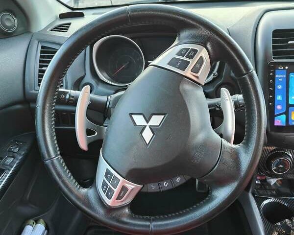 Серый Мицубиси Outlander Sport, объемом двигателя 2 л и пробегом 189 тыс. км за 11200 $, фото 13 на Automoto.ua