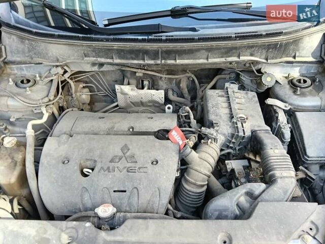 Серый Мицубиси Outlander Sport, объемом двигателя 2 л и пробегом 169 тыс. км за 8800 $, фото 12 на Automoto.ua