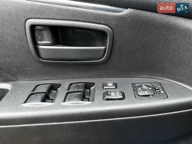 Синий Мицубиси Outlander Sport, объемом двигателя 2 л и пробегом 177 тыс. км за 12000 $, фото 18 на Automoto.ua